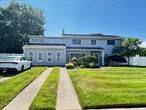 Huge Copiague Harbor Colonial Professionally Landscaped, 10 Rooms, Walk to Beach, X-Zone - no flood insurance required. Beach, marina, and boat rights in lagoon available, association $200 yearly. Must see this huge expanded colonial, granite countertops, stainless steel appliances. 2 separate sunrooms, all windows - 20x40, cathedral ceilings. Gas heat - 4 zones, central air. Roof, convention oven, 12 years old. Great for a large family - room for mom! Will not last! Bring your whole family!