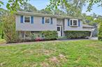 This impressive raised ranch in Dutchess Park is currently on the market, seeking a new owner. The property boasts 4 bedrooms and 2 full baths. Recently refinished hardwood floors on the main level of the home enhance its aesthetic appeal. Fresh painted the main level of this home, ensures the property is in move-in condition. The spacious living room features a large bay window, allowing for an abundace of natural sunlight. The dining room offers hardwood floors, a ceiling fan, and a sliding glass door leading to a recently painted 3 tier deck, perfect for barbecues and family gatherings. The deck is suitable for installing an above-ground pool.  The kitchen is equipped with ample cabintry, laminate flooring, and updated appliances. The lower level features an additional bedroom and a versatile room suitable for use as a family room or playroom. There is a large storage room that has the laundry room and a walk-in closet. There is also a working water softener as well. The hot water heater is 90 gallons and runs off the solar panels. 200 amps electric, The expansive backyard provides ample space for children to play. This property benefits from public water and sewer services. Notably, a new central air unit was installed in July 2025. It is essential to schedule a viewing for this property today, as it may not remain available tomorrow.