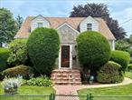 Spacious 5-Bedroom Cape Cod with Hardwood Floors & Prime Location!Welcome to this beautifully maintained and versatile 5-bedroom Cape Cod-style home, ideally situated in a vibrant and convenient neighborhood in Uniondale School district. This home offers both space and flexibility which is perfect for large or growing families.Step inside to discover a home with gleaming hardwood flooring. Carpeted rooms also have hardwood flooring underneath, creating a warm and timeless foundation for your personal style. The main floor boasts three oversized bedrooms, a full bath, and a dedicated media room or home office, perfect for remote work, study, or leisure.Enjoy your mornings or wind down in the evening in the bright rear sun porch with jalousie windowsâ€”a peaceful space filled with natural light.Upstairs, youâ€™ll find two additional bedrooms, a cozy den, and another full bath with a separate outside entrance ideal for guests or extended family.The fully finished basement offers exceptional versatility, featuring a third full bathroom, laundry room, bar, and a private outside entrance making it an excellent option for entertaining or potential in-law living.Recent upgrades include a brand-new hot water heater. The house has natural gas heating, a detached two door garage, and a private driveway with space for up to five cars with additional street parking.Located just minutes from Roosevelt Field Mall, Nassau Coliseum, state and county parks, major highways, and the LIRR, this home offers unbeatable access to shopping, recreation, and commuting options.Donâ€™t miss the opportunity to own a spacious, move-in-ready home with room to grow!