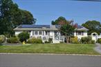 Welcome to this beautifully updated 5-bedroom, 3 full bathroom ranch. This spacious and well-maintained home is clean, move-in ready, and perfect for families seeking comfort, convenience, and flexibility. The main level features primary bedroom and bath with your own private porch and 3 additional bedrooms and family bath. Kitchen was entirely renovated in 2019 complete with stainless steel appliances, granite counters, skylights, hi-hats. All the bathrooms were renovated in 2022. Both the formal living room and den have fireplaces. Off the den is a spacious and inviting sunroom with floor to ceiling windows and skylight and access to back deck and rear yard. The lower level offers additional living space complete with bedroom, full bathroom, additional den/playroom providing a great space for extended family or guests with privacy and ease. Additional highlights include a separate laundry room, 2 zone heat, 1 zone CAC, 8 security cameras, 200 amp electric service, extra room for storage, chair lift for easy access to lower level, Genrac propane generator, Solar panels, separate water heater, 5 skylights thru out house, 6 zone outside sprinkler. Outside, 2 car garage (lower level) plus additional parking on main level. This home is located in the highly regarded Sachem School District and is close to public transportation (LIRR), MacArthur Airport, shopping, schools, Parks and the Long Island Expressway (LIE)â€”putting everything you need within easy reach.