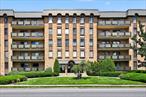 Sun-filled, south facing, top floor spacious 2-bedroom condo apartment at The Maple Arms! Great features include: Large living room/dining area with sliding doors to terrace, eat-in kitchen with gas cooking, three large, fitted walk-in closets, 2 bedrooms, 2 full baths. Also included is wall-to wall carpeting, tile flooring, built-in AC units, ceiling fan, stacked washer/dryer in closet. Condominium features refreshed lobby, large gym with baths, dry sauna, locker room and showers and mail room/delivery room. There is a huge deck with seating, tables with umbrellas and a fenced built-in pool. Every owner gets a covered parking spot. Condo has an $165. assessment thru March 2026. Owner can rent unit after 18 months of ownership. One parking space per unit, 1 free bin per unit although, if available, others can be purchased for $50/month. Close to Westbury Village, LIRR, great parks, fabulous shopping, all major parkways and south shore beaches! Do not miss.