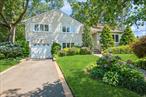 This spacious Split-Level home offers comfortable, centrally located Nassau County living at its best. Featuring three bedrooms, two-and-a-half bathrooms, an attached one-car garage, finished basement and is set on a lushly parklike lot with trees, shrubs, and plants providing both privacy and shade. Highlights include gleaming hardwood floors, abundant natural lighting, and four levels of living space. The main level has an open, airy layout from the large, bright living room and dining area to the open kitchen featuring a skylight and ample counter and cabinet space to make meal preparation a breeze. Open the sliding glass doors and step out onto the deck to your own nature preserve overlooking a large stone patio, perfect for entertaining. Upstairs is the primary bedroom with its own en suite bathroom, two additional bedrooms, a full bathroom in the hallway, and easy access to the finished top level attic space. On the ground floor is a large den with built-inbookshelves and sliding glass doors opening directly onto the patio, along with a half bathroom, laundry room, and access to the garage. The finished basement offers a recreation room and lots of extra storage space. Perfectly situated on a quiet block and close to the 930-acre Eisenhower Park with golf courses, pool, ball fields, playgrounds and skating rinks. Also, many options for stores, eateries and close to major highways and the LIRR making for an easy commute and quick access to South Shore beaches. All the elements needed for a comfortable everyday living.