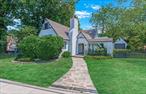 Welcome Home! Located in coveted Douglaston, renowned for early 20th century Tudor charm. This classic 4-bedroom, 2-bath residence offers a spacious and luminous setting in a quiet, tree-lined neighborhoodThe first floor has serene bedroomsâ€”perfect for a guest suite or home officeâ€”tucked on the first floor and one full bath, ideal for convenience.The Living room warmed by a working fireplace and gleaming hardwood floors with oversized windows.The Formal dining room with French doors opening to the side yardâ€”flooded with natural light.The Kitchen featuring marble countertops, tiled floors, and ample room for cooking together and the â€œnook areaâ€, enough room for a deck or place to relax.Youâ€™ll love the family room appointed with slate floors and wraparound windows showcasing a graceful trellis and landscaped patio.The second floor has two additional bedrooms offering flexibility for family, guests, or office use and a full bathroom, easily accessible for upstairs occupants.As for the exterior, this home sits on an 84 Ã—105 ft corner lot, providing privacy and spaceâ€”with potential for expansion.The one-car garage complements the landscaped frontage, with matching stucco as the home itself.There is ductless AC throughout the first floor ensures comfortable, efficient cooling.Why Youâ€™ll Love this home and living here.Timeless Tudor elegance, blending historic architectural character with modern comfort.Room for the growing familyâ€”4 spacious bedrooms, 2 full baths, and a large footprint.Light-filled living areas, with French doors, extensive windows.Prime Douglaston location, walking distance to the LIRR, Schools, Parks and endorsed by a strong sense of community.This home is oil heat with 2 zone heating.