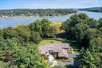 Set on 9 private acres along Mill Neck Creek, 8 Mill Pond Lane in Lattingtown is a rare waterfront sanctuary that blends bold contemporary architecture with natural serenity. Enjoy sunrise and sunset views, elevated lawns with sweeping vistas to the waterâ€™s edge, and a layout ideal for year-round indoor and outdoor living in the Locust Valley School District.A soaring 25-foot great room with a sculptural fireplace and walls of glass anchors the airy interior, bathing the space in natural light. The chefâ€™s kitchen, flanked by dual butler pantries, flows seamlessly from casual to formal dining areas and extends effortlessly to the outdoor entertaining spaces.The first-floor primary suite features vaulted ceilings, a stone-clad fireplace, and a spa-like bath. On the second level, two guest wings, a library, and a second living room offer flexibility and privacyâ€”each with its own water view.Outdoor amenities include a heated gunite pool with spa, a four-season entertaining area, shoreline access for kayaks, and unmatched seclusion, all while sailboats drift byâ€”yet you&rsquo;re just minutes from NYC. A finished basement, three-car garage, and walkable beach access complete this exceptional one of a kind setting. Interior Photo Coming Shortly