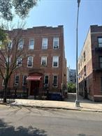 6 family brick building Semi-detached. 15 Bedrooms, 6 baths.