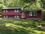 This Split- level sits on 3.3 acres, it includes a one bedroom, one bath, kitchen, living room Cottage. Main house featuring Living room. dining L, three bedrooms, two full baths, hook up for a half bath in the full finished basement. Two car garage. House needs some TLC.