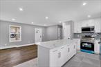 Welcome to 42 Leaf Avenue!This beautifully renovated home is designed for modern living, featuring a brand-new kitchen with new cabinets, sleek quartz countertops, and a bright, open-concept layout that creates an inviting space. The kitchen is also equipped with a faucet ready for a water filtration system, adding both convenience and functionality.Throughout the home, youâ€™ll find new flooring and a brand-new washer and dryer, making everyday living effortless. Smart upgrades include motion detector lights in the hallway, front, and backyard, as well as a smart thermostat for optimal comfort and efficiency.The bathroom offers a touch of luxury with a defogging LED mirror and a bathroom fan with a built-in Bluetooth speaker, perfect for a spa-like experience.Additionally, this home comes with solar panels included by the builder at no cost to the buyer, providing energy efficiency and long-term savings.Move-in ready and packed with thoughtful upgrades, 42 Leaf Avenue is the perfect place to call home!
