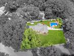Incredible opportunity, magnificent, sprawling ranch in Miller Place School District on an oversized corner .52 flat lot featuring beautiful cedar impression front siding, 10-year-young roof, and custom stone exterior skirt, all surrounded by professionally landscaped grounds and a truly spectacular resort-style backyard. This outdoor paradise offers multiple entertaining areas, an L-shaped in-ground salt water swimming pool with 2 year young liner and 1 year young looploc cover, expansive brick and cement patios, white PVC fencing for privacy, and a jacuzzi tub for the ultimate in leisure and hosting. Inside, enjoy 5-ton, 2-year-young central AC, gas heat, an open floorplan with vaulted ceilings, recessed lighting, surround sound, and custom box and crown molding throughout. Rich bamboo hardwood floors flow through the formal living room with a striking stone wood-burning fireplace and oversized bay windows, into the elegant dining room, and down into a dramatic sunken great room filled with natural light from oversized skylights and anchored by a second cozy wood-burning fireplaceâ€”perfect for everyday comfort or unforgettable gatherings. The enormous chefâ€™s kitchen is truly the centerpiece of the home, featuring oak cabinetry, granite countertops, stainless steel appliances including a double oven, built-in microwave, Samsung refrigerator with built-in water and ice dispenser, and a wine fridge. At the heart of the space is a center island with a gas cooktop and stylish pendant lighting, complemented by an additional raised bar counter ideal for high-top barstoolsâ€”making this not only an entertainerâ€™s dream but a true chefâ€™s kitchen. Tile backsplash, under-cabinet lighting, recessed lighting, and a tray ceiling add warmth and sophistication, while glass doors provide direct accessâ€”one to the side yard and the other to your private backyard retreat. The primary suite includes crown molding, ceiling fan, a massive walk-in closet with custom shelving, and a spa-like ensuite bath with an oversized glass-enclosed shower finished in gray subway tile, white vanity, crown and chair molding, recessed lighting, and surround sound. Additional generously sized bedrooms continue with bamboo flooring, and the stylish main hallway bath includes both a tub and shower for added flexibility and function. Home features inground sprinklers, two car garage with storage area, boiler room, and possible additional bonus space.