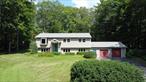 Welcome to 107 Tonche Terrace, Shokan, NY. Tucked away in a semi-secluded setting, this spacious 1, 888 sq ft raised ranch offers the perfect balance of privacy and convenience. Featuring 3 bedrooms and 3 full bathrooms, the home also includes a versatile den, a cozy library, and a dedicated office-ideal for working from home or hosting guests. The open main living area provides plenty of natural light, while the lower level offers flexible space for relaxation or entertainment. A two-car garage adds functionality, and the .77-acre lot provides room to enjoy the outdoors. Located just minutes from a variety of local attractions including Belleayer Mountain, Emerson Resort Kaleidoscope and the Rail Explorers pedal power adventure. With proximity to the City of Kingston, Village of Woodstock and the hiking trails of the Ashokan Reservoir, this property offers both tranquility and easy access to everything the area has to offer.