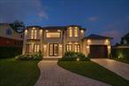 A rare opportunity to own a nearly completed custom-built residence in the prestigious gated community of Bayside Gables. This approximately 6, 000 sq. ft. home is 80% complete and ready for a new owner to bring their final vision to life.Designed with elegance and scale in mind, the home features 4 bedrooms, 4 full bathrooms, and dramatic architectural details throughoutâ€”including a double-height entry foyer, 20â€™ folding glass wall, radiant heated floors, and steel-framed windows. The open-concept layout offers a chefâ€™s kitchen with island, formal dining, and expansive living spaces filled with natural light.The finished basement provides additional living space with rooms for flexible use, while the backyard is prepped for a future pool. Located in a private, guard-gated community with 24/7 security, this home offers both privacy and potential.