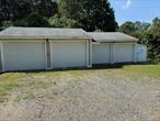 So you are looking for a place to store your cars or maybe a place to work on your personal vehicles. This is a 4 car garage that can easily fit 8 or more. Garage space includes Boiler, 60G compresser, 30 and 50 AMP Circuits. The garage is heated. Look no further. House is also for sale. On nearly 9 acrs with additional commercial lot attached.