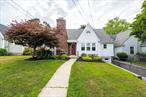 Cutest house you will ever see!! This pristine Cape is just what you are looking for. Nestled on a quiet street of like homes, this meticulously maintained home offers 4 bedrooms and 2 full bathrooms. Built in 1931 this home still boasts its original charm - unique rounded front door, brick and stone chimney, original doors, refinished original hardwood floors, original french doors and black/white tiled first floor bathroom while offering updates that add to the homes beauty. Spacious living room with fireplace and dining room, semi-updated kitchen, 2 good sized bedrooms - one which has access to an updated back deck with trek decking and lovely unilock paved patio. The sunlit second floor landing opens up to a smaller bedroom with double french doors and a primary suite with updated bathroom with tiled shower and large closet which turn the primary bedroom into a cozy haven and perfect place to unwind. The basement offers a one car garage and laundry. There is a b-dry system to ensure a dry basement. A house like this doesn&rsquo;t come along that often....stop in and make it our own.
