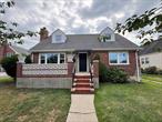 Nicely update 4 bedroom, 2.5 bath expanded CAPE in the heart of the Village of New Hyde Park. Hardwood floors throughout. Rear extension with television room/den, a dining room and living room area with crown molding and a wood burning fireplace. A recently update galley kitchen with real wood cabinets, quartz countertops, stainless steel appliances, and island. All 2.5 bathroom have been update over the past year. Four spacious bedrooms. Finished basement with a bonus room/home office, laundry area, half bath, utility area. A one car detached garage. Lovely park view. Close to everything, worship, parks, shopping, travel.