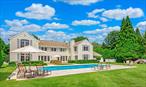 Bridgehampton Village  Quiet Elegance on Estate-Like GroundsBridgehampton Village  Quiet Elegance on Estate-Like Grounds Hidden behind tall hedges in one of the Hamptons&rsquo; most coveted locations, this elegant Bridgehampton Village home offers the rare combination of privacy, sophistication, and timeless design. Set on nearly an acre of beautifully landscaped grounds in close proximity to shops, restaurants and ocean beaches, the setting is as tranquil as it is convenient. The floor plan is thoughtfully designed for today&rsquo;s lifestyle with great flow throughout. Multiple bedroom suites provide a sense of privacy while still allowing for an easy, connected way of living. A classic center hall entry opens to sunlit interiors with refined architectural details and high-end finishes. There are three fireplaces: wood-burning in the living room, and gas in both the great room and an upstairs bedroom suite, each adding warmth and a sense of serenity to these spaces. A well designed kitchen with center island seating connects seamlessly to the great room, which then opens onto the outdoor dining courtyard, stunning grounds, and heated pool, creating a perfect indoor/outdoor flow for entertaining and relaxed living. The formal dining room and expansive living room, anchored by the wood-burning fireplace, provide a variety of gathering spaces. The home includes five bedrooms, four full baths, and two half baths, including a cabana-style half bath with outdoor access and a separate first floor powder room. Among the five bedrooms are three generously sized en-suite private suites including one on the first floor and two on the second, offering multiple options for privacy, comfort, and ease of living. Two additional upstairs bedrooms share a full bath, creating a layout that provides flexible accommodations for a variety of living arrangements. The 20&rsquo; x 40&rsquo; heated gunite pool anchors the lush landscape, surrounded by mature evergreens and flowering perennials that create a true behind the hedges experience. The pool features an expansive stone patio ideal for both casual and formal poolside gatherings. The outdoor dining courtyard is the perfect setting for leisurely lunches, barbecues and formal dinner parties. A large custom outdoor shower complements the outdoor amenities. Additional features include a mudroom off the kitchen, an attached two-car garage, and a whole-house backup generator. The full ready-to-finish lower level can be transformed for a variety of uses, and provides the opportunity to create additional owner-desired amenities. A rare opportunity to own a beautifully designed, impeccably maintained home on a quaint street in the heart of Bridgehampton -classic, flexible, and designed for easy living at every stage.