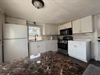 Updated in 2023, this charming unit features an open-concept living room and kitchen, 2 spacious bedrooms, and a generously sized bathroom. This is an outright purchase of the home with a monthly land lease of $1, 100, which includes water, sewer, garbage removal, property taxes, and one designated parking space. Additional parking is available for an extra monthly fee. Boat slips are also available up to 24 feet. No dogs permitted â€“ no exceptions. One indoor cat is allowed. This 1970 Van Dyke 12x38 single-wide includes an addition for extra living space. Located in the heart of Islip, the home sits in a peaceful waterfront mobile home community south of Montauk. NO FLOOD INSURANCE REQUIRED. Features include propane cooking and hot water, stainless steel appliances, a stacked washer and dryer, a storage shed, and new skirting and windows.