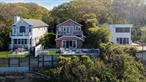 Tucked away in one of the North Shore&rsquo;s most exclusive and private beach communities, this custom-designed waterfront home is a rare find a true hidden gem offering privacy, elegance, and breathtaking views of the Long Island Sound and Connecticut coastline. Crafted with a thoughtful open-concept design to maximize light and space, the home offers seamless indoor-outdoor living, perfect for both grand entertaining and quiet coastal relaxation. Enjoy direct private beach access, stunning sunsets, and the soothing sounds of the shoreline all just steps from your door. This exceptional home features two expansive primary suites, a gated driveway, and a versatile bonus room opening to a sun-filled four-season sunroom ideal for use as a guest retreat, office, or wellness space. Offered furnished or unfurnished, this turnkey property is ready to meet your lifestyle whether you&rsquo;re looking for a luxurious weekend escape or a serene year-round residence.Key Features: Exclusive location in a private beach community, Direct private beach access, Unobstructed panoramic water views, Two spacious primary suites, Light-filled sunroom with flexible bonus room, Gated driveway and private setting, Available furnished or unfurnished.