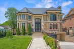 A High-End Custom Resort Style Modern Mansion in Little Neck. Welcome to an extraordinary custom mansion, built in 2016, in the prestigious Little Neck area, where architectural vision meets uncompromising luxury on an expansive 11, 520 sq ft lot (60x198). This 5, 640 sq ft masterpiece begins with a breathtaking 20-foot grand foyer that sets the tone for unparalleled craftsmanship throughout. The coffered ceiling living room and formal dining room create sophisticated entertaining spaces, with oversized windows flooding each room with natural light. At the heart of this resort-style sanctuary lies your crown jewelâ€”a magnificent 400 sq ft climate-controlled indoor heated pool with humidifier, delivering year-round aquatic luxury. The culinary experience reaches new heights with a custom Cambridge kitchen showcasing premium Wolf and Sub-Zero appliances, complemented by a secondary service kitchen that ensures effortless entertaining for any occasion.Comfort is elevated to an art form through ten-zone radiant floor heating, eight-zone central air, and centralized fresh air circulation with 24-hour filtration throughout every corner of this architectural marvel. Indoor and outdoor living merge seamlessly through a stunning gazebo-style sunroom that opens to your lush backyard oasis, complete with a built-in DSC BBQ set for the ultimate alfresco dining experience. Exceptional craftsmanship reveals itself in every detailâ€”from floor-to-ceiling stonework and rich engineered hardwood to the distinctive Welsh slate roof and elegant copper gutters. Your personal wellness retreat features an authentic Canadian cedar sauna, therapeutic soaking Jacuzzi tub, and a glass-enclosed double shower with commercial-grade Hansgrohe systems, creating a spa-inspired bathroom that rivals the world&rsquo;s finest resorts. Entertainment reaches cinematic heights in your dedicated 7-seat home theater, where leather recliners face a commanding 120-inch screen powered by 1, 240 watts of premium audio-visual technology. The formal wine cellar satisfies the most distinguished connoisseur while enhancing daily living with sophisticated storage for your finest vintages. Thoughtful luxury extends throughout with an integrated 12-zone music system, central vacuum convenience, and dual laundry rooms for seamless daily living. The grand, curved staircase, adorned with bespoke iron railings, serves as a stunning architectural focal point, while energy efficiency is maximized through the use of spray foam insulation. Quaker windows and doors frame picturesque views while flooding interiors with natural beauty. The fully finished basement expands your living possibilities with an additional 1, 800+ sq ft of entertainment space, while a two-car garage provides practical luxury. This architectural masterpiece transcends ordinary luxury living, creating a private resort where every carefully crafted detail serves both beauty and functionâ€”the ultimate expression of modern sophistication and refined comfort.