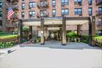 Welcome to the Andrew Jackson Condominium, a well-maintained elevator building in the heart of vibrant Jackson Heights. This spacious unit features a beautifully updated kitchen with elegant countertops, stainless steel appliances, and ample cabinet space. The open-concept living and dining area boasts refinished hardwood floors and a smart, functional layout. Step out onto your private patio and enjoy a peaceful morning or evening breeze with open-sky views. Additional highlights include generous closet space and a sleek, modern bathroom with tasteful tile finishes. Amenities include a laundry room, outdoor swimming pool, recreation room, 24-hour doorman, and an intercom system for added convenience and security.