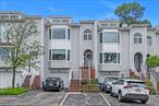 Welcome to this beautifully renovated Beechwood model in the highly sought-after Oak Park at Douglaston. Offering 1, 137 square feet of thoughtfully designed living space, this 2-bedroom, 2-bath condo features a modern open-concept layout with upscale finishes throughout.The kitchen has been fully renovated with quartz countertops, stainless steel appliances, and custom cabinetry, seamlessly flowing into a spacious dining and living area perfect for entertaining. Both bathrooms have been tastefully updated with contemporary fixtures and tilework.Enjoy the convenience of in-unit laundry, generous closet space, and a layout that offers both privacy and functionality. Oak Park is a gated community known for its meticulously maintained grounds, tennis courts, outdoor pools, clubhouses, and easy access to transportation, shopping, and major highways.Move right in and experience resort-style living in Douglaston.