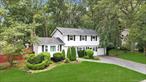 Incredible opportunity to own this magnificent, expanded, and sprawling split-level Colonial situated on an oversized corner lot in the highly desirable Half Hollow Hills Central School District! Bursting with curb appeal, this home boasts a four-year-young roof, crisp white vinyl siding with stylish black shutters, custom paving stone driveway, and a welcoming front path in a neighborhood lined with sidewalks and professionally manicured landscaping. Step into the open floor plan and be greeted by gorgeous tile flooring in the formal living room, flowing seamlessly into your chefâ€™s kitchen complete with maple cabinets, tile backsplash, stainless steel appliances, tons of cabinet and counter space, gas cooking, and a fridge with water and ice. The kitchen opens into a breathtaking den/great room featuring vaulted ceilings, skylights, a full brick wall with a cozy wood-burning stove, and a sliding glass door out to your entertainerâ€™s dream yard with an oversized paving stone patio. The first floor also offers a stylish powder room, a laundry area with front-loading stainless steel washer and dryer plus upper cabinets, and a versatile first-floor bedroom perfect for extended family or a home office. Just a few steps up from the entry, enjoy a formal living room with gleaming hardwood floors, soaring vaulted ceilings, and loads of natural light. The second level features an enormous primary suite with hardwood floors and a stunning full bath with a glass stand-up shower, as well as additional spacious bedrooms and a second hallway bath with tub and shower. A part basement adds more flexible space, and all windows were updated approximately three years ago. This home is packed with upgrades, style, and spaceâ€”donâ€™t miss your chance to own a one-of-a-kind gem in one of the areaâ€™s most sought-after school districts!