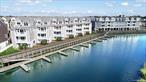 Come and view this well-designed condo suite at Marina Pointe. The open concept living room, contemporary kitchen with an island and dining area are flooded with natural light. Enjoy a private balcony with water views. The king-sized primary suite has an oversized closet and a large ensuite bath with dual sinks. The spacious second bedroom has easy access to the hall bath which includes a tub. In-unit laundry, stainless steel appliances, covered parking, plenty of storage and included snow removal round out the complete package of this maintenance free home! Make it yours today. Sale may be subject to term & conditions of an offering plan. This property is subject to an existing tax exemption as outlined in the offering plan. Purchaser should independently verify tax information.