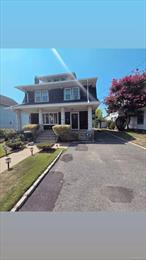 Charming Colonial-Style Home in the Heart of LynbrookWelcome to 127 Hempstead Avenue, a beautifully maintained Colonial-style single-family home built in 1924. This classic residence offers timeless character paired with modern convenience, featuring approx. 2, 536 sq ft of living space on a desirable 6, 000+ sq ft lot.The home includes 5 spacious bedrooms and 3 full bathrooms, highlighted by gleaming hardwood floors, a cozy fireplace, and abundant natural light. All brand new kitchen appliances - New Roof (<5 Years young), Windows & Doors. The finished walk-out basement offers additional storage space and includes brand new Washer/Dryer and a full bathroom. Other features include a walk-up attic, detached garage, and ample closet/storage space throughout.Enjoy central heating and window A/C units for year-round comfort. Located in the highly regarded Malverne UFSD, near Davison Avenue Intermediate, Howard T. Herber Middle School, and Lynbrook Senior High School.With a Walk Score of 84 (very walkable) and Transit Score of 54, this home offers easy access to parks, shops, dining, and public transportation. A must-see opportunity combining charm, space, and location!