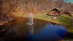 This rustic log cabin home nestled amidst a tranquil pond. 195 + acres of air so fresh and crisp, carrying the scent of pine and damp earth. This home is a perfect retreat for relaxation and reflection. A bonus pond on the top of the mountain loaded with fish. Come enjoy the porches&rsquo; views of the pond reflecting the sky above and the trees that line the banks. Spend your nights curled up around the inside fireplace. Spacious game room featuring a bar, pool table and card table. Fire pits, grills, and a scenic overlook for you to enjoy. A finished barn for entertainment and a bar upstairs. Take a hike up the mountain or an ATV to check out the orchard and quarry. If you love to hunt this is the place for you, roads and trails with 5 large hunting stands throughout the property. Bring your family or friends to make amazing memories. A few minutes&rsquo; drive to the beautiful Delaware River, where you can fish, swim, or kayak. Close to French Woods camp, Resort World Catskills, Roscoe Mountain Club, farmer markets, and Bethel Woods Center for the Arts. NYC is only 2 hours away!!