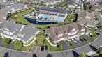Welcome Home to this impeccably and stylishly designed 3 Bedroom, 2 1/2 Bath, Essex model End Unit, with views of the Pond, Fountain, Pools and Club House, located in the sought-after gated community of Country Pointe Meadows!! This unit is one of only a few that are NON-AGE restricted! This stunning condo WOWS from the moment you enter, and exudes discerning style, sophistication and elegance throughout! This turn-key Residence offers the perfect blend of modern upgrades, low-maintenance living, and resort-style amenities. Step inside to find a bright and spacious open-concept layout featuring high, soaring ceilings, hardwood floors, and custom finishes throughout. The Chef&rsquo;s Kitchen is equipped with stainless steel appliances, a Kohler farm sink, Quartz countertops with an extended Quartz backsplash, custom Kitchen cabinetry with pull-out drawers and a custom pantry, ideal for both everyday living and entertaining. The Kitchen also features a window seat which was smartly integrated into the Kitchen area, to add both comfort and space. The gracious Dining Room flows seamlessly into the stunning Living Room, featuring a wall of windows and glass sliders, as well as a gas fireplace, providing additional ambience and warmth during those darker, cooler months. The glass sliders off the Living Room lead directly to your private patio, where views of the Pond, Fountain and Pools add another layer of beauty and tranquility to your time spent outside. Enjoy entertaining friends and family alike with a delicious meal on the grill! Back inside, the First Floor Primary Suite dazzles with a custom wood-beamed ceiling, designer finishes, dual closets and a stunning spa-like ensuite bath, featuring a fully-tiled shower with glass doors, dual vanities and anti-fog mirrors. There is also an attractive powder room on the first floor as well a separate laundry room. On the second floor, there is a spacious loft which doubles as a home office, as well as two additional Guest Bedrooms, one of which has its own custom window seat, ideal to take in the Pond and Fountain views. They are both generously sized and share a nicely appointed Full Bath with a tub. As if all this weren&rsquo;t impressive enough, the completely finished Lower Level is a DREAM COME TRUE! It comprises a Media Room with an electric fireplace, which movie/TV buffs will fall in love with, a gym for fitness buffs, a bar perfectly tailored to accommodate your favorite bottles and wine collection, and a truly impressive, expansive closet, which surely will accommodate your entire wardrobe and shoe collection! Country Pointe Meadows is part of The Boulevard, a master-planned community that will offer a mix of residences, offices, retail shops, dining establishments, (Starbucks included!), medical facilities, open spaces and parks. Simply stated, you will have everything here at your fingertips, and so much more! Easy travel to/from NYC and other areas of Long Island. Live the lifestyle you so richly deserve! **Please note: 227 Belmont Circle will be available to close once the current Homeowners are able to close on their under contruction unit in Country Pointe Preserve.