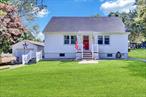 Close to parks, beaches, shopping, professional offices, schoolsLarge partially wooded lot, level to rolling. The house is on 1 lot and there is an attached secondary lotThe area features non-development as well as development style homes. There is a partial winter waterfront view. There is a new cesspool. Owner relocating.