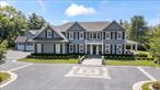 Welcome to one of North Syossetâ€™s most distinguished new estates. Privately set on 5 gated acres, this striking property combines architectural elegance, modern comfort, and a rare sense of privacy. The main residence offers over 11, 000 square feet of thoughtfully designed living space with soaring ceilings, expansive windows, and seamless indoor-outdoor flow. Ten bedrooms and twelve bathrooms, including a luxurious primary suite, provide exceptional space for both everyday living and large-scale entertaining. A separate 2, 000 square foot guest house offers flexibility for visitors, extended family, or private work-from-home quarters.Resort-style amenities include 2 state of the art outdoor kitchen areas, a heated gunite pool with spa, a private tennis court, a dog run, a playground and a serene pond, all surrounded by lush, manicured grounds. The property is located on a quiet private road within the Syosset Central School District and zoned for Berry Hill Elementary, offering both convenience and exclusivity. This is a rare opportunity to own a newly constructed compound that defines high-end living on Long Islandâ€™s North Shore. LOW TAXES!