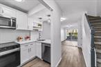 Be the first to live in this fully renovated, turn-key home. The brand-new kitchen is equipped with sleek stainless steel appliances and quartz countertops - ready for your first home-cooked meal. A stylishly updated powder room and a beautifully renovated full bath add to the fresh, modern feel. Wood-style flooring spans the main level, while new carpeting creates comfort and warmth in the private quarters upstairs. The second-floor laundry area features a brand-new washer and dryer, neatly tucked behind sliding doors for convenience and style. Step outside to enjoy your private patio - perfect for barbecues and balmy summer eveningsâ€”or cozy up by the fireplace during winter months. Pet-friendly (weight restricted), with assigned parking included. Just steps to vibrant downtown shops, dining, and Metro North â€“ Grand Central is only 35 minutes away. Thereâ€™s truly nothing to do but move in and enjoy!