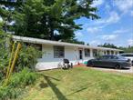 Excellent investment opportunity with this fully rented duplex ranch located on a quiet, private road. Each unit features 1 bedroom and 1 bathroom, offering low-maintenance living with steady rental income. Enjoy peaceful lake views (no lake rights), while tenants appreciate the privacy and convenience of this quiet property. Tenants pay their own electric. New roof and decks installed within the last 2 years. Septic recently emptied. Instant income with both units currently rented. This is a great opportunity for investors seeking a reliable, income-producing property in a desirable setting.