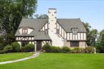 Tucked away on a quiet, tree-lined street in the heart of Gedney Farms, this exceptional English Tudor offers a rare blend of architectural charm, modern luxury, and sweeping golf course views. Overlooking the rolling greens of Westchester Hills Golf Club, the home is a private sanctuary just minutes from downtown White Plains.Step inside to discover a grand entry hall that leads to a sun-drenched living room with fireplace. An elegant formal dining room with French doors opens to a screened-in porch overlooking the expansive grounds, perfect for entertaining or enjoying quiet mornings. The oversized chefâ€™s kitchen features a large island, breakfast nook, and an adjoining family room, creating an effortless open-concept layout ideal for both daily living and gatherings.Upstairs, the spacious primary suite includes a cozy reading nook, tranquil fairway views, a beautifully renovated bathroom, and a walk-in closet. Three additional bedrooms are generously sized, including one with private access to a large balcony overlooking the course.The home has been extensively renovated, with a reimagined kitchen and baths, Marvin custom windows and doors, upgraded central HVAC, a full exterior repaint and lush professional landscaping. The roof has also been updated, and the fully fenced backyard offers both charm and functionality.With hardwood floors throughout, a walk-up attic, and a beautifully landscaped 0.36-acre lot, this move-in-ready Tudor delivers refined living in one of White Plainsâ€™ most desirable neighborhoods just minutes from vibrant downtown amenities, parks and Metro-North. Whether youâ€™re seeking a full-time residence or a weekend retreat, this home offers the perfect blend of privacy, elegance, and country club serenity all just 34 minutes from Grand Central.