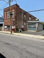 A/O. No further showings. Earn 11% return on investment or a lot more. Great Historic brick building on Front Street in the Renaissance City of Port Jervis. This Huge 3500 square foot building is Active Business downstairs and two modern residential apartments upstairs. Walk to NYC Trains. This is a Huge money maker! Could be Great as an Air B&B which would bring the CASH in hand over fist. As is now Business pays $2200 per month and apts bring in $5100 gross every month of $61000 gross per year. Net return on Income is $49, 000 per year as tenants pay water sewer and utilities.