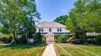Welcome to this Classic Center Hall Colonial, nestled in the picturesque neighborhood of Cathedral Gardens. Situated on an expansive 100 x 249 square-foot lot, this home offers timeless charm blended with modern updates throughout. Step inside to find gleaming hardwood floors and a large formal dining room featuring elegant built-in corner cabinets. The spacious eat-in kitchen boasts granite countertops, a center island, stainless steel appliances, and a cozy brick gas fireplace. Sliders open to a patio overlooking a deep, lush backyard-perfectfor outdoor entertaining.The formal living room includes a wood-burning fireplace and leads to a newly renovated office or family room, offering flexible living space. Two updated half baths complete the first floor.Upstairs, the second level features a generous primary suite with ensuite bath, plus three additional bedrooms and a modern fullbathroom. The third floor offers two walk-in closets that could easily serve as additional bedrooms or creative space.Additional highlights include: New windowsRenovated bathroomsNew paver patio and walkwaysSeparate hot water heater New boilerMint condition inside and outThis is a rare opportunity to own a meticulously maintained home on a sprawling lot in a sought-after location.