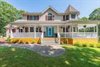 On a private road, at the end of a quiet cul-de-sac, 15 Douglas Lane offers timeless elegance, carefully curated updates, and rare privacy on 2.5 acres of partially wooded land. This beautifully renovated 4-bedroom, 4-bathroom Victorian features close to 4, 000 square feet of living space and is move-in ready from top to bottom. A charming wraparound porch sets the tone, welcoming you into a high two-story foyer with 24-foot ceilings and a dramatic chandelier. The main level offers an expansive, well-connected layout where each space transitions smoothly to the next. It features solid hardwood flooring, a sophisticated formal dining room, sun-drenched living areas, and an inviting family room centered around a striking stone wood-burning fireplace. A convenient utility entry off the 3 car garage offers built-in storage, hanging space, and room to keep the everyday clutter out of sight. The chefâ€™s kitchen is both beautiful and functional, showcasing a substantial center island, 42â€ upper cabinetry, and a dedicated propane line for precision cooking. Sliding glass doors invite natural light and open seamlessly to the partially wooded backyard oasis, where a newly installed in-ground pool is surrounded by a premium Armor Tech patio and elegant fencing. The tranquil setting creates a true resort-style experience right at home offering both privacy and peace of mind. Upstairs, you&rsquo;ll find four generously sized bedrooms, each with walk-in closets and new hardwood flooring for a seamless, luxurious look. The primary suite offers comfort, space, and privacy featuring a beautifully renovated en suite bathroom. The large walk-in closet was designed with both comfort and sophistication in mind. The full basement offers incredible potential with updated plumbing and electric already in place. Thoughtfully designed with future expansion in mind, itâ€™s prepped for easy heating zone hookup and ready to be transformed into additional living space. Endless potential awaits, ideal for a private guest retreat, state-of-the-art home gym, cinematic media room, or sophisticated entertainment space. Equipped with dry wells and quality systems already installed, the foundation is set for luxury-grade customization.