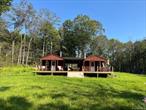 Quiet, Quiet, Quiet, if you are looking for that getaway like no other this is the place for you!! Can you say wild life, camp fires, yard games, trails, sun rise, sun sets, streams, hunting, and more!! Well this property has it all. Two newly not quite finished ranch style cabins joined under one roof with a large deck for the friends and family. This property is nicely located just out side the sought after hamlet Livingston Manor, it has shops, eateries, and state land only minutes away. You are also within a 30 minutes drive to skiing, hiking, tubing, snow boarding, fishing, swimming, and the famous Resorts World Casino in Monticello.