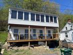 An exceptional and rare opportunity to own a piece of the Hudson Riverfront between two of the regionâ€™s most iconic landmarks, the Mid-Hudson Bridge and the Walkway Over the Hudson. Located on the Highland side, presenting a blend of natural beauty and historic charm. At the heart of the property is a c.1840s two bedroom, one bath home, offering timeless character and panoramic views of the Hudson River. Watch the sunrise over the water and enjoy front-row seats to the beauty of the Walkway and Bridge, all from your own yard. Whether youâ€™re seeking a private riverfront retreat or a unique investment, this offering is unmatched in location, charm, and opportunity.
