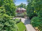 A beautiful blend of Victorian and Craftsman design eras, Rockledge at Harriman is a masterpiece of architectural style. With period details including thick fieldstone walls, original woodwork, the turret spanning all four levels, glass pocket doors, window seats, and two wood-burning fireplaces.The beautifully updated eat-in-kitchen which overlooks the pool, is equipped with top-of-the-line appliances and artistic lighting. Along with the expansive living room and formal dining room, completing this level is a 1st floor bedroom and full bathroom. The master bedroom suite on the 2nd floor includes an immense walk-in closet, water closet, steam shower and jetted whirlpool tub, plus an east-facing Juliet balcony for breathtaking sunrises. 4 additional bedrooms complete this level. With 10â€™ ceilings and light-filled rooms, this 6+ bedroom home offers nearly 5, 000 sq ft of living space including the full walk-up attic with fantastic living space and plenty of storage, and the finished walk-out basement. The basement, with a wet bar, fireplace, and half bath, adds another fabulous gathering space and has two private entrances allowing access from either the driveway, or the pool.The outdoor space offers the luxury of an inground saltwater heated pool with spa and waterfall, multiple outdoor terraces, a level lawn, and the impressive and unspoiled surroundings of nature. The patio and rooftop deck on the western side of the home offer picturesque mountain views of sunsets and starry skies amid the curated gardens. Strategically positioned atop the hill of Rockledge Gardens, the house sits on a dead-end private 1.75-acre lot with no through traffic, offering sublime privacy and a wondrous, peaceful setting abutting Harriman State Park.Village life and commuting options are a dream as the home is located within a mile of downtown Suffern, offering quaint shops, fabulous restaurants, and public transportation. NJ Transit is less than a mile away with an express train to Penn Station in under an hour.Updates include: boiler and 75 gal water heater (2025), exterior wood siding paint (2022), appliances (2020-22), in-ground gunite, heated, salt-water pool w waterfall and spa (2014), fenced-in yard.