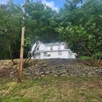 This early 20th century homestead is nested on a hill just outside the trendy town of Livingston Manor, 3+BR, 1B offers easy living with convenience to town restaurants and state parks. Refinished wood floors really set the tone and relaxing on the cozy porch really displays the mood. Great for full or part time living, airbnb and more with many rooms upstairs along with a spacious bedroom located on the first floor. The covered car port makes things easy located right outside the back door that goes into the kitchen and a handy attached tool room/shed is located off the covered patio area. Easy access to River, fly fishing Museum, state land and lakes, the list goes on & on! Must see!!!