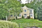 Set atop a scenic perch in the highly sought-after Woodlands community, this 5-bedroom, 3-bath Center Hall Colonial offers the perfect blend of elegance, comfort, and resort-style amenities. Enjoy southern exposure with breathtaking views of the Ramapo Mountains and exclusive access to an outdoor pool, tennis and pickleball courts, a fitness center, and a community clubhouse. A grand two-story entry welcomes you with soaring ceilings and a dramatic catwalk that overlooks both the foyer and the scenic mountain vistas with a formal Living Room and Dining Room with a striking new banister and hardwood floors. Sophisticated architectural details flow throughout the home, including the impressive two-story great room with floor to ceiling windows and a wood-burning fireplace. The renovated chefâ€™s kitchen boasts white and grey cabinetry, a center island, quartz counters, stainless steel appliances, pantry, and opens to a sun-drenched four-season sunroom. An additional family room with vaulted ceilings and custom built-ins offers flexible space for entertaining or relaxing. A fifth bedroom with office built-ins and a French door that leads to patio area is perfect for guests/home office. An adjacent full bath near bedroom and convenient laundry with ample cabinetry completes the first level. Upstairs, the luxurious primary suite features a tray ceiling, sitting area, and a spa-like ensuite bath with a large shower, double sinks, and a jacuzzi tub. Three additional generously sized bedrooms each include double closets. The partially finished lower level includes a Owens Corning basement system, wine cellar, ample storage and newer furnaces and hot water heater. A three-car garage comes equipped with a CCS car charger. Your private backyard oasis is perfect for entertaining and relaxing, with a trex deck,  hot tub, fire pit, and serene viewsâ€”all surrounded by protected parkland. Enjoy EZ living at the Woodlands as HOA offers total lawn care and snow removal. Just minutes to the Tuxedo train station-ideal for NYC commuters-40 miles to NYC . Nearby is The Tuxedo Club and Sterling Forest&rsquo;s hiking, fishing and kayaking for the perfect work-life balance.