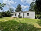 This move-in ready 1949 traditional cottage sits on 1.3 picturesque acres in the heart of the Hudson Valley. Thoughtfully preserved with original wood flooring, trim, and a charming wooden scalloped eave awning, the home offers timeless character and warm curb appeal. Inside, you&rsquo;ll find two bedrooms plus an additional laundry room that could flex as a home office. Exterior features include underground gutter drainage, and updated underground electric to the detached carriage-style garage, perfect for a workshop or studio. A second outbuilding provides space for gardening and storage. This cozy home was updated with care and respect for green building values, avoiding toxic chemicals and quick cosmetic fixes in favor of simplicity and sustainability. Located in the sought-after Arlington School District with convenient proximity to Vassar College, Marist College, and the Taconic State Parkway.  Ideal one level living in Dutchess County!