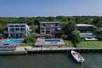 Fire Island Pines.A Bayfront Original with Elevated Potential.Welcome to Clamalot, a bay-front classic with a name as unforgettable as its setting. Perched high on a dune and accessed by a private bridge from Bay Walk, this 5-bedroom, 3.5 bath beach house sits above the flood zone and offers panoramic views of the Great South Bay.Built in 1974 and held by the same family ever since, Clamalot is a true original, full of character, privacy, and possibility. From the lionâ€™s head knocker to the hand-lettered nameplate on the gate, every detail hints at the homeâ€™s storied past and one-of-a-kind charm.Inside, a multi-level layout offers room to gather or retreat, with a full-floor primary suite and sliders opening to a private bayview balcony. Main living and dining areas connect to multi-tiered decks ideal for entertaining. Outside, enjoy a decked-in pool with a new liner, and an updated Navy-style bulkheadâ€”ready for kayaks, paddle-boards, and sunset sails.While the home awaits your vision and updates, its foundation is rare: high elevation, water frontage, and a legacy of single ownership.Clam-a-Lot isnâ€™t just a houseâ€”itâ€™s a Fire Island original, ready for its next chapter.