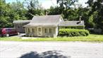 Nestled on a .32-acre parcel with an additional adjacent lot of 0.37 acres, this charming ranch-style home at 198 Tinkertown Rd offers a blend of comfort and functionality. The residence features two bedrooms and a single bath, providing an intimate and well-maintained living space. The living room is enhanced by a vaulted ceiling and a handsome stone fireplace, creating a warm and inviting atmosphere.The property includes a dining area for formal meals and a den equipped with a pellet stove, offering an alternative heating source and a cozy retreat. Numerous updates have been implemented throughout the years, ensuring the home is move-in ready. A rear deck extends the living space outdoors, ideal for relaxation or entertaining.This property presents a unique opportunity with its comfortable living spaces and generous land. The inclusion of an adjacent lot provides possibilities for expansion, gardening, or simply enjoying additional privacy. With its appealing features and desirable location, 198 Tinkertown Rd is perfect for first time home buyers or a country retreat!