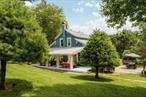 Overbrook House is a design-forward Catskills retreat on nearly an acre that lives much larger thanks to multiple eye-popping indoor/outdoor spaces including a dreamy separate Guest Studio (not included in square footage). The meticulously styled main house features a den paneled with reclaimed barnwood, while the more formal living room&rsquo;s gas fireplace is great for ease of use and tidiness. A bright enclosed porch welcomes you inside, and the cheerful country kitchen with open shelving flows into a spacious dining room. French doors open to a covered outdoor patio with wood ceiling, perfect for dining and lounging. Three bedrooms (one on the main floor) and two full baths offer flexibility, and all rooms reflect a cohesive design aesthetic. The detached Guest Studio upstairs in the barn feels like a designer treehouse, with a full kitchen, bath, queen bed and lounge area surrounded by windows. The heated pool with cedar deck and auto-cover is a showstopper, complemented by a restored 1957 Airstream, custom fire pit, and multiple areas for al fresco dining. Tucked behind the barn is â€œthe grottoâ€ â€” a hidden nook with hot/cold plunge and a spot to dine or unwind. Cross a private footbridge over Buck Brook to reach Callicoon Hills for a meal or live music at the summertime band stand. Offered furnished (with exclusions); adjacent buildable half-acre lot also available.