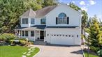 Welcome to this magnificent 4, 000 sq ft Colonial, built in 2005, nestled on an oversized 11, 800 sq ft lot in the heart of Bethpage. This 5-bedroom, 2.5-bathroom masterpiece blends timeless elegance with modern functionality, perfect for families seeking luxury and convenience. Step into the grand double-height entry foyer, where high ceilings and custom base/crown moldings set a sophisticated tone. The first floor boasts a spacious living room, formal dining room, and a gourmet kitchen with a center island and cozy breakfast nook. The expansive family room, featuring a wood-burning fireplace and exquisite coffered ceilings with custom woodwork, is ideal for gatherings. A convenient powder room completes this level. Upstairs, the massive primary suite is a true retreat, showcasing vaulted ceilings, his-and-hers walk-in closets, and a luxurious en-suite bathroom with a soaking tub, dual vanity, and shower. Four additional generously sized bedrooms, a full bathroom, and a dedicated laundry room provide ample space and comfort for all. The full walkout basement offers endless possibilitiesâ€”perfect for storage, entertainment, a home office, theater, or an in-law suite (with proper permits).Outside, the nearly 12, 000 sq ft lot provides abundant space for outdoor activities and entertaining, with room for future enhancements like a pool or garden. The attached 2-car garage offers ample parking and storage. Located minutes from Bethpage schools (elementary, middle, and high), Bethpage State Park, Bethpage Train Station, and the Seaford-Oyster Bay Expressway, this home offers unparalleled access to recreation, commuting, and community amenities. Additional highlights include pristine condition, custom craftsmanship, and a prime location that blends suburban tranquility with urban connectivity. Perfect for discerning buyers seeking space, style, and convenience, this Bethpage gem wonâ€™t last long. Schedule your private showing today!