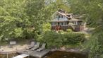 Nestled on an iconic 0.77-acre lakefront parcel, Chalet Sunset offers a rare opportunity to own a nostalgic seasonal retreat in the heart of the cherished Wanaksink Lake community. This original lakefront home offers 4 spacious bedrooms and multiple gathering areas. This charming summer camp-style home is designed for making lifelong memories with family and friends. The main chalet exudes warmth and character, with exposed wood beams, an abundance of windows that capture lake views and natural light, and a striking stone fireplace that anchors the living space. Whether you&rsquo;re enjoying cozy evenings indoors or sunny afternoons on the dock, this home welcomes relaxation and recreation. The property includes a garage, carport, shed, and a delightful mini chalet â€“ perfect for guests, storage, or a private retreat. The spacious yard gently slopes to the lakefront where your own dock awaits, ideal for kayaking, paddleboarding, or simply soaking in the sunset views. Located within the sought-after Wanaksink Lake Association, residents enjoy a vibrant, close-knit community with events, and activities for all ages, and pristine, non-motorboat waters ideal for swimming and serenity. Whether you&rsquo;re seeking a peaceful seasonal getaway or a fun-filled lakeside escape, Chalet Sunset is a true gem â€“ full of history, heart, and endless summer potential. This home is available move-in ready, fully furnished and includes the dock. The home is available fully furnished if desired. By appointment only please!
