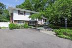 This charming split-level home in the Commack School District offers comfort, style, and space for everyone. Step into a bright and airy living room featuring wood flooring, crown molding and a large picture window that fills the space with natural light. The recently remodeled kitchen boasts new white cabinetry,  new quartz countertops, subway tile backsplash and stainless steel appliances, perfect for everyday living and entertaining. With three bedrooms and a spacious den complete with a wood-burning fireplace thereâ€™s plenty of room to relax or gather with family. Outside, enjoy a beautiful yard with flowering plants and a composite deck and paving stone patioâ€”ideal for summer fun and outdoor entertaining. Additional highlights include a, partial basement for extra storage or flex space, new gas heating system , new central air-conditioning, and new cesspool. This well maintained home is close to all amenities shopping and transportation.