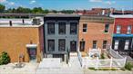 Welcome to 1735 Pacific Street, a fully renovated two-family townhouse located in the heart of Crown Heights, Brooklyn. This exceptional property has been completely rebuilt from the ground up, offering the peace of mind that comes with brand-new construction. Everything has been thoughtfully updated from new framing, a block extension, and subfloors to a new roof, new windows, and fully certified plumbing, electrical, and a new water meter approved by the City of New York.Both apartments are beautifully finished, featuring modern kitchens equipped with five-burner stoves, microwaves, and refrigerators. There are three full bathrooms throughout the home, providing comfort and convenience for larger households. The first and second floors boast gleaming hardwood floors, while the finished basement is designed with stylish tile flooring. Each level is climate-controlled with energy efficient split-unit heating and cooling systems, three units on each floor and two in the basement.Private outdoor balconies on both the first and second floors offer a tranquil space to unwind. The finished basement adds valuable living space and includes a washer and dryer, two hot water tanks, and its own heating and cooling perfect for extended living, recreation, or storage.Turnkey and move-in ready, 1735 Pacific Street is the ideal choice for buyers seeking modern comfort and long-term value in one of Brooklynâ€™s most dynamic neighborhoods.