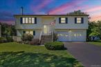 Welcome to this beautifully maintained 3-bedroom, 2-bath raised ranch in the highly desirable Butter Hill Estates, served by the top-rated Cornwall School District. Offering 1, 980 sq. ft. of flexible living space, this home features a bright, open layout and a finished basement with endless possibilities. A versatile fourth room is ideal as a guest suite, office, or creative space, with rough plumbing already in place for a full bathroom.The backyard is designed for enjoyment, boasting a full fence, sparkling pool, low-maintenance Trex deck, and hot tub for year-round relaxation. An attached two-car garage provides additional storage and convenience.Perfectly located just minutes from the Newburgh waterfrontâ€™s restaurants and entertainment, Stewart International Airport, and major highways, this home makes commuting to NYC a breeze.